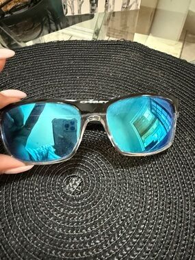 Oakley Men's Sunglasses with Blue Mirrored Lenses and Black Frame